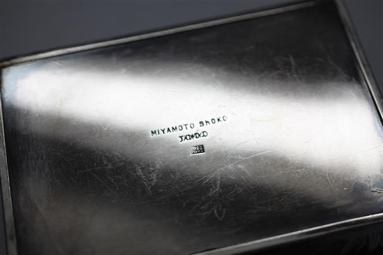 Three early 20th century Japanese textured silver toilet boxes, two signed Miyamoto Shoko, largest 6in.